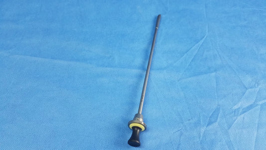 A slender metallic standard obturator instrument component with black ergonomic handle and yellow accent ring compatible Olympus