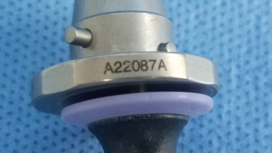 Silver metallic olympus germany a22087a obturator deflecting tip with hexagonal collar engraved a22087a and purple rubber seal