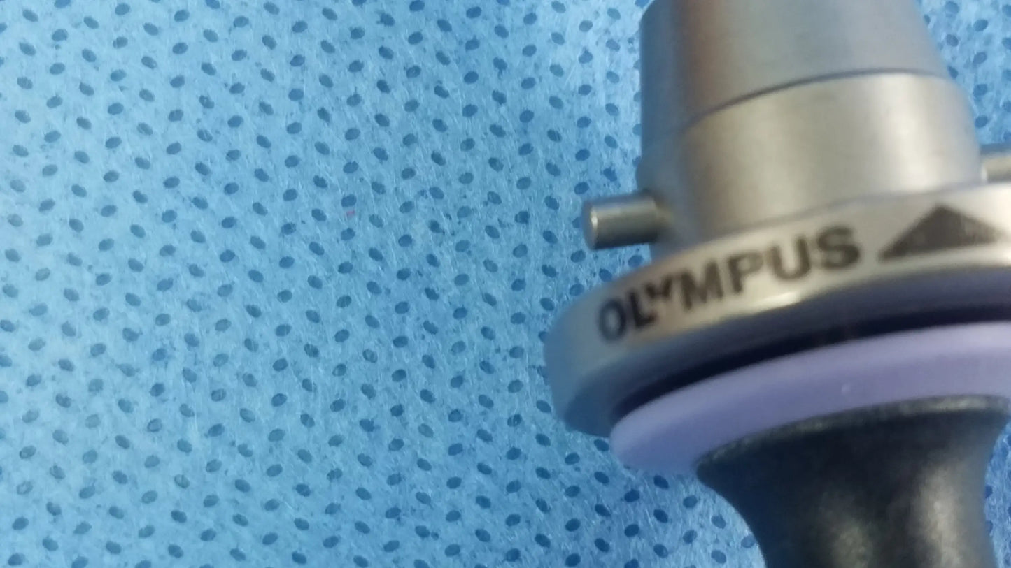 Silver Olympus Germany A22087A obturator deflecting tip surgical scope with black handle and purple rubber ring