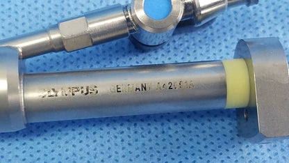 Silver metallic olympus a42091a working insert with yellow rubber seal and blue component for richard wolf hystero-resectoscope tray