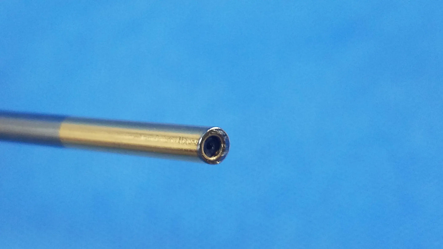 Metallic cylindrical rod with two-tone silver and gold finish and worn open-ended tip compatible olympus cystoscopic a22002a