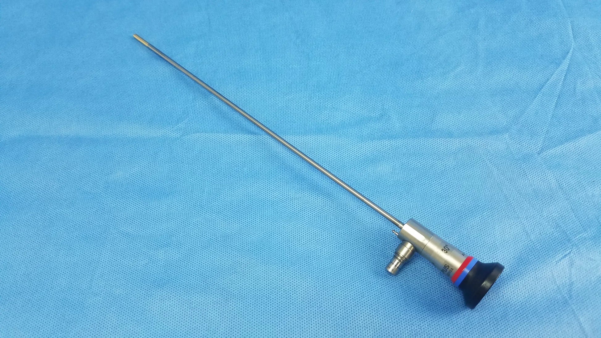 Silver surgical endoscope with black and red handle and long metallic shaft compatible olympus cystoscopic a22002a