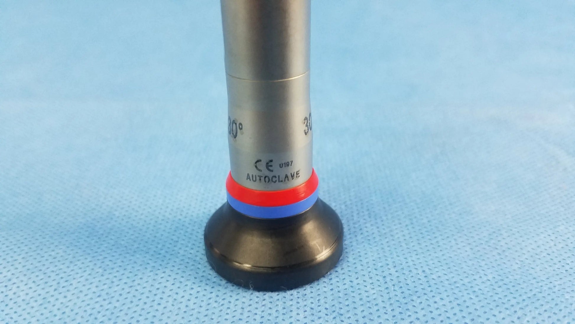 Silver surgical autoclave cystoscope with black base red and blue bands marked autocrave compatible olympus cystoscopic a22002a