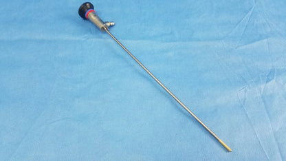Silver surgical endoscope with black and red handle, metallic shaft, and yellow tip compatible olympus cystoscopic a22002a