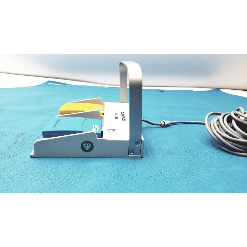 White shimano olympus MAJ-1258 UES-40 pedal foot switch with yellow and blue foot pedals for precise control