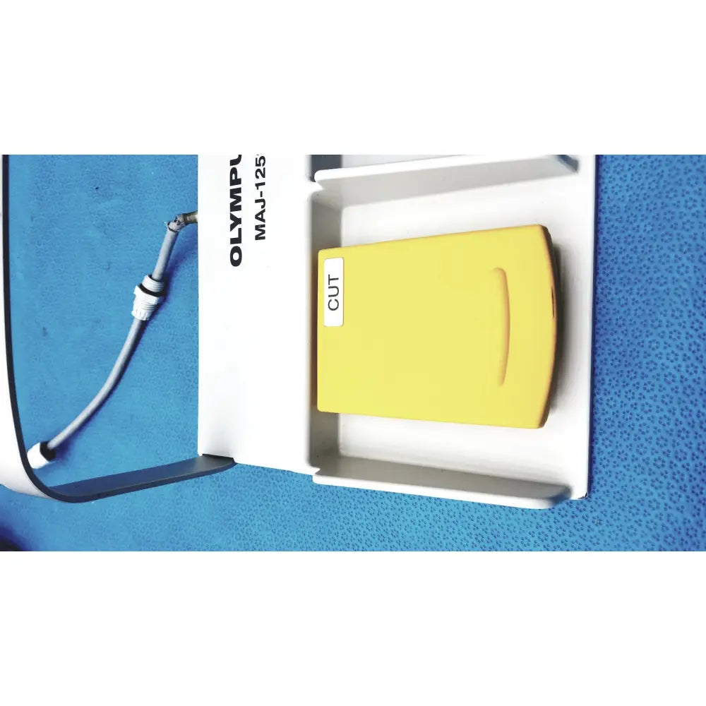 Yellow rectangular pedal foot switch labeled cut part of olympus maj-125 device in olympus maj-1258 ues-40 foot switch