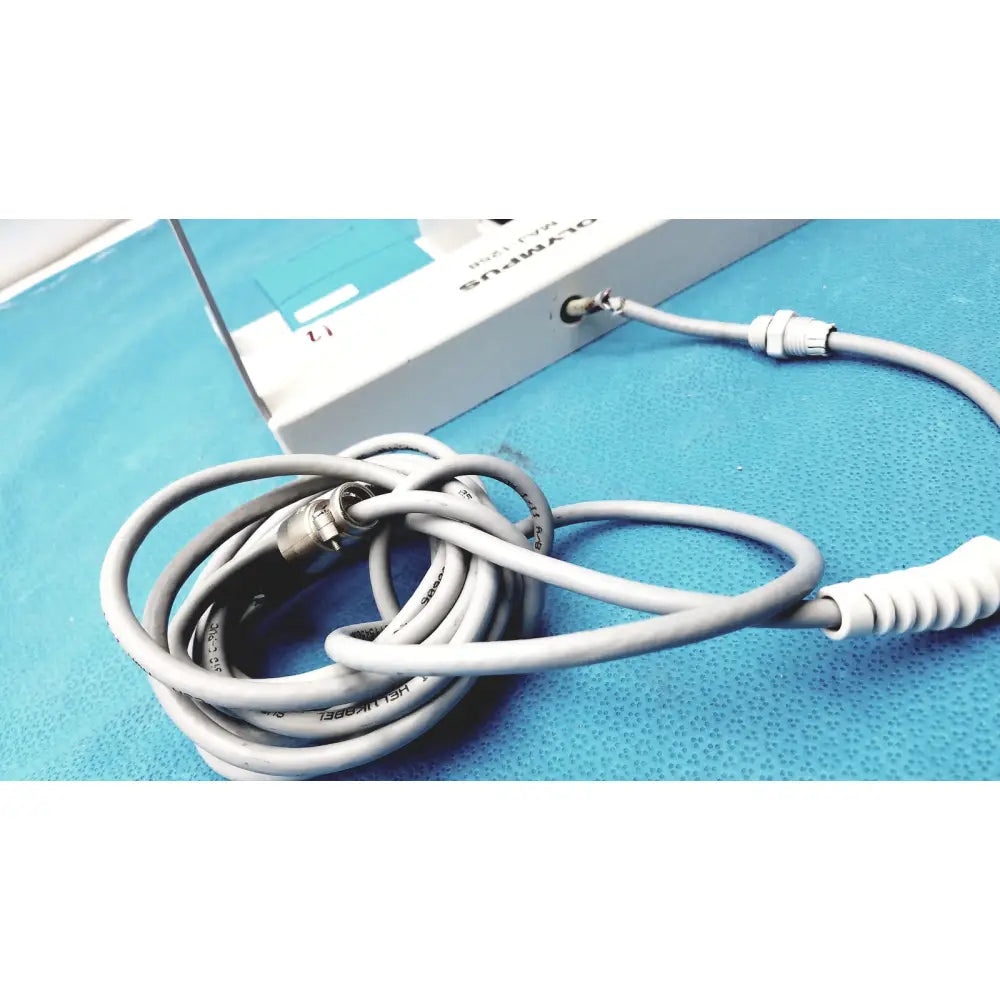 Gray coiled cable with metallic connectors and white spiral grip for olympus maj-1258 ues-40 pedal foot switch