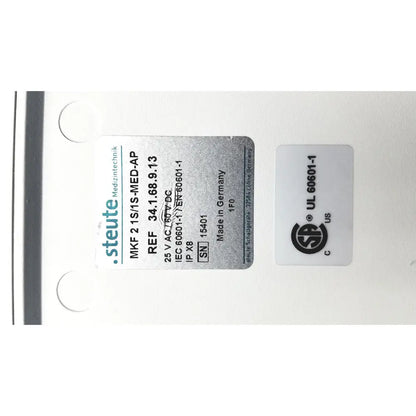 Silver metallic label with black text and logo detailing steute olympus maj-1258 ues-40 pedal foot switch product details