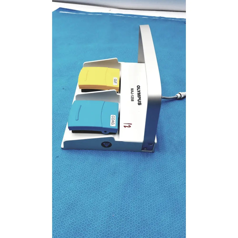 White Olympus MAJ-1258 UES-40 pedal foot switch with yellow and blue footswitches for surgical use