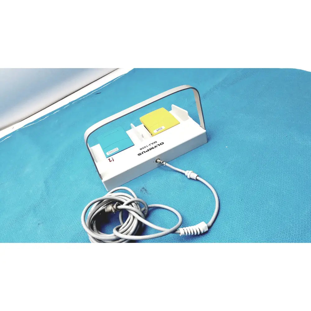 White Olympus MAJ-1258 UES-40 dual-button pedal foot switch with teal and yellow push buttons and silver handle