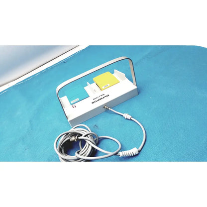 White Olympus MAJ-1258 UES-40 dual-button pedal foot switch with teal and yellow push buttons and silver handle