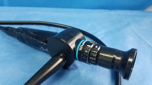 Black flexible fiber optic endoscope with textured grip and blue control ring branded stryker by olympus medical systems