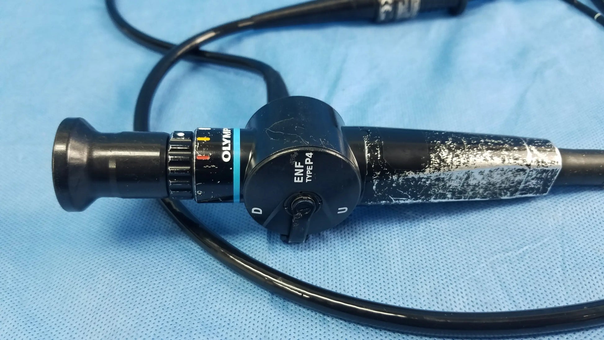 Black olympus medical systems enf-p4 flexible fiber optic endoscope with textured grip and visible control dial branding