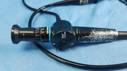 Black olympus medical systems enf-p4 flexible fiber optic endoscope with textured grip and visible control dial branding