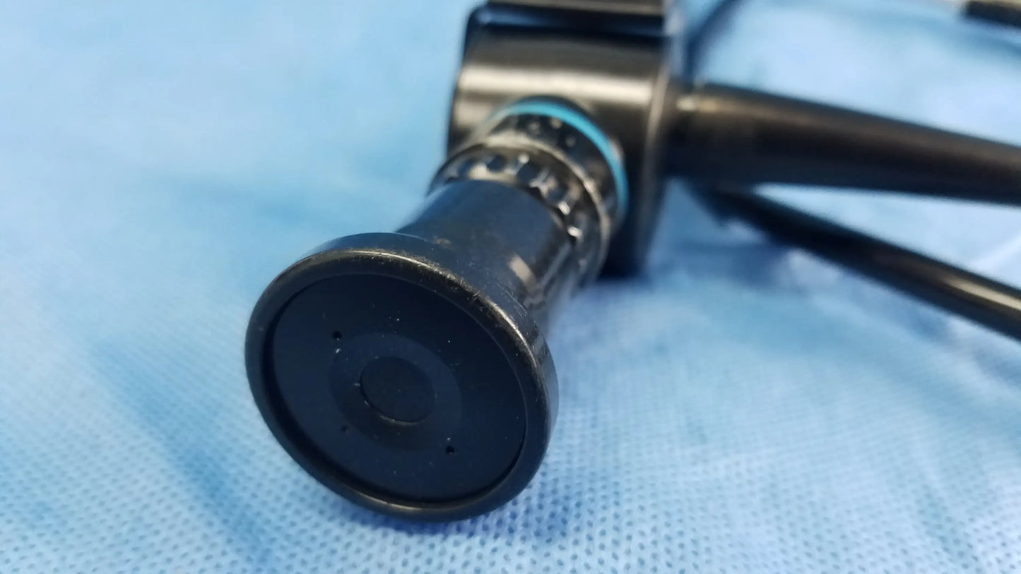 Black flexible fiber optic endoscope with circular lens and metallic rings by Olympus Medical Systems ENF-P4 model