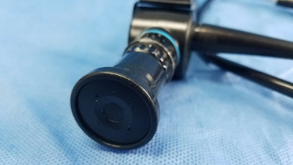 Black flexible fiber optic endoscope with circular lens and metallic rings by Olympus Medical Systems ENF-P4 model