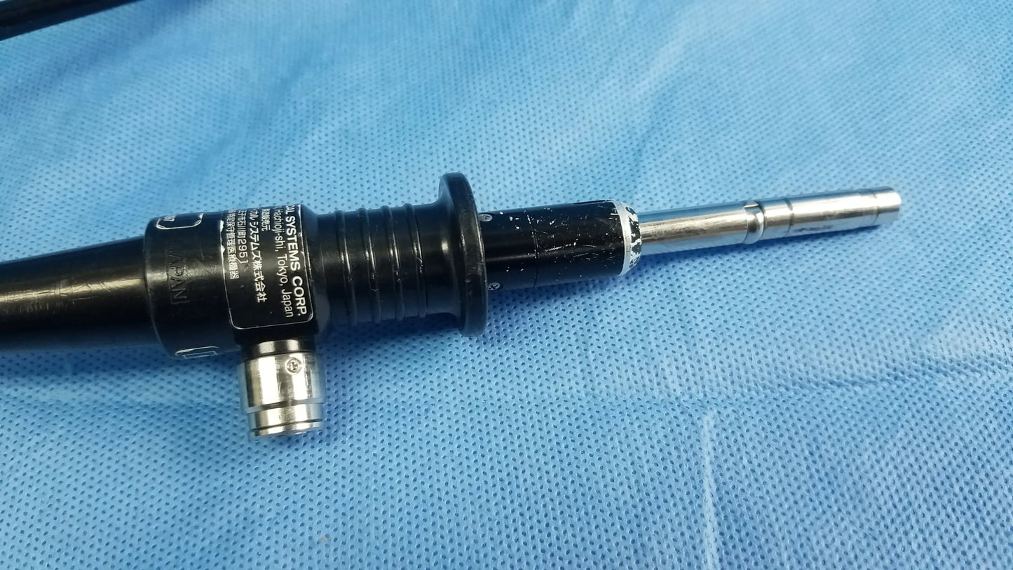Black and silver flexible fiber optic endoscope with textured grip and metallic tip by Olympus Medical Systems