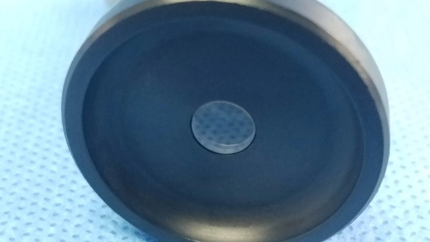 Black circular speaker with metallic center grille on the back of olympus oes elite hd 70° rigid telescope ref wa2t470a