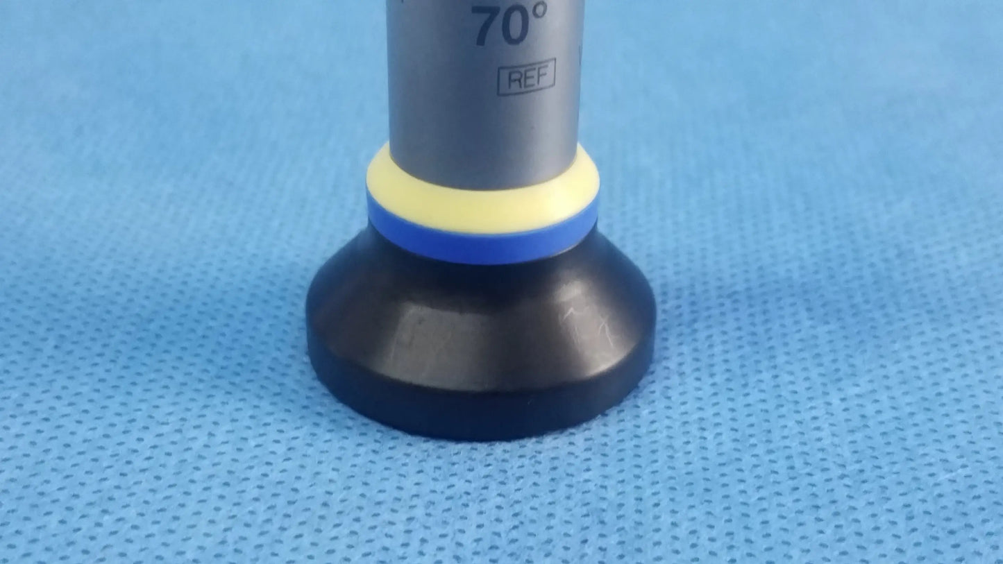 Gray cylindrical rigid telescope with black base and yellow blue rings olympus oes elite wa2t470a model