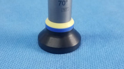 Gray cylindrical rigid telescope with black base and yellow blue rings olympus oes elite wa2t470a model