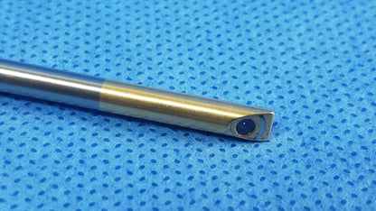 Metallic surgical drill bit with polished silver shaft gold tip and blue mark for olympus oes elite rigid telescope wa2t470a