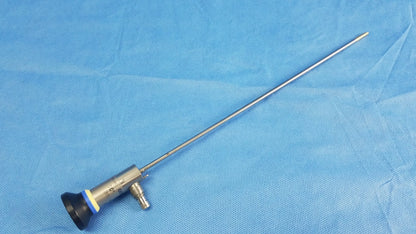 Silver Olympus oes elite wa2t470a rigid telescope with black rubber tip and blue accent ring for surgical use
