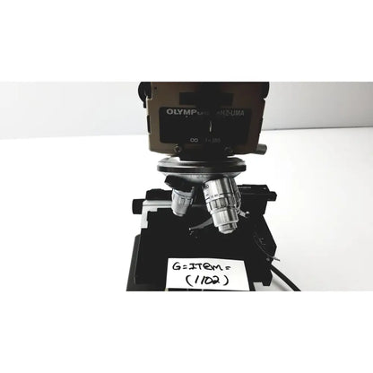 Olympus optical bh2-uma microscope with metallic silver and black components for precise laboratory analysis