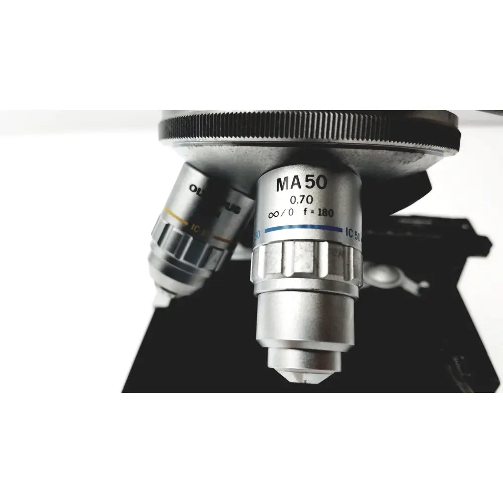 Silver olympus optical bh2-uma microscope objective lens with 0.70 numerical aperture and metallic finish