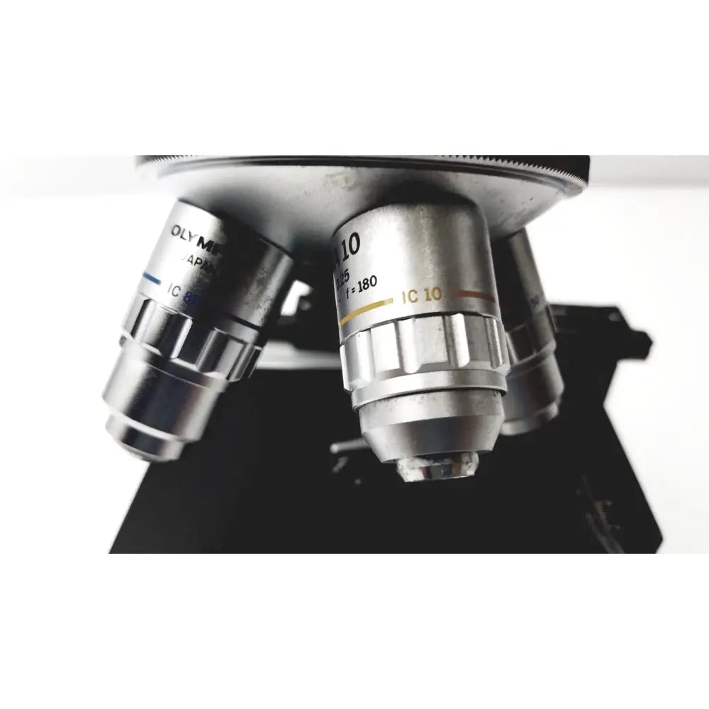 Silver metallic microscope objective lenses with engraved markings and ridges for olympus optical bh2-uma microscope