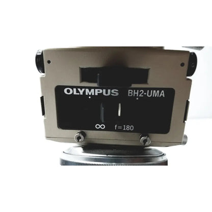 Olympus optical bh2-uma microscope with beige body and black label featuring white text for precise laboratory use