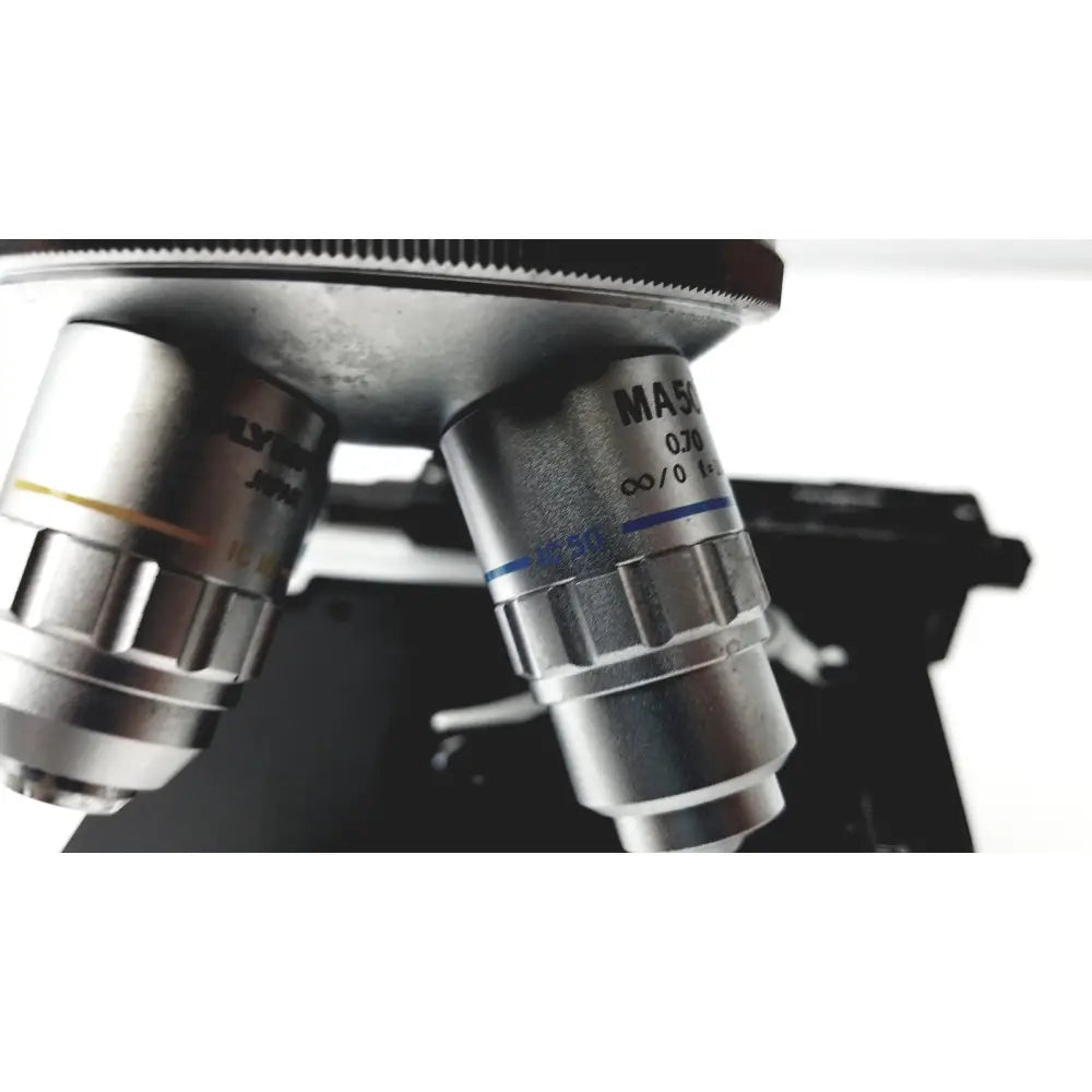 Silver metallic microscope objective lenses with engraved markings and blue lines for olympus optical bh2-uma microscope