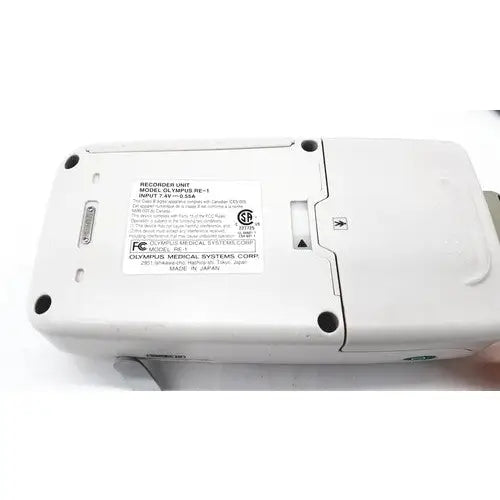 White plastic olympus re-1 endocapsule recorder unit with black screws and model label for lead set use