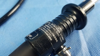 Black fiber optic endoscope with ribbed barrel and metallic tip engraved olympus systems corp rhino laryngoscope enf-p4 fiber optic