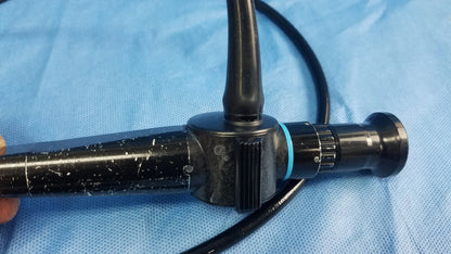 Black olympus rhino-laryngoscope enf-p4 fiber optic endoscope with textured grip and blue accent ring