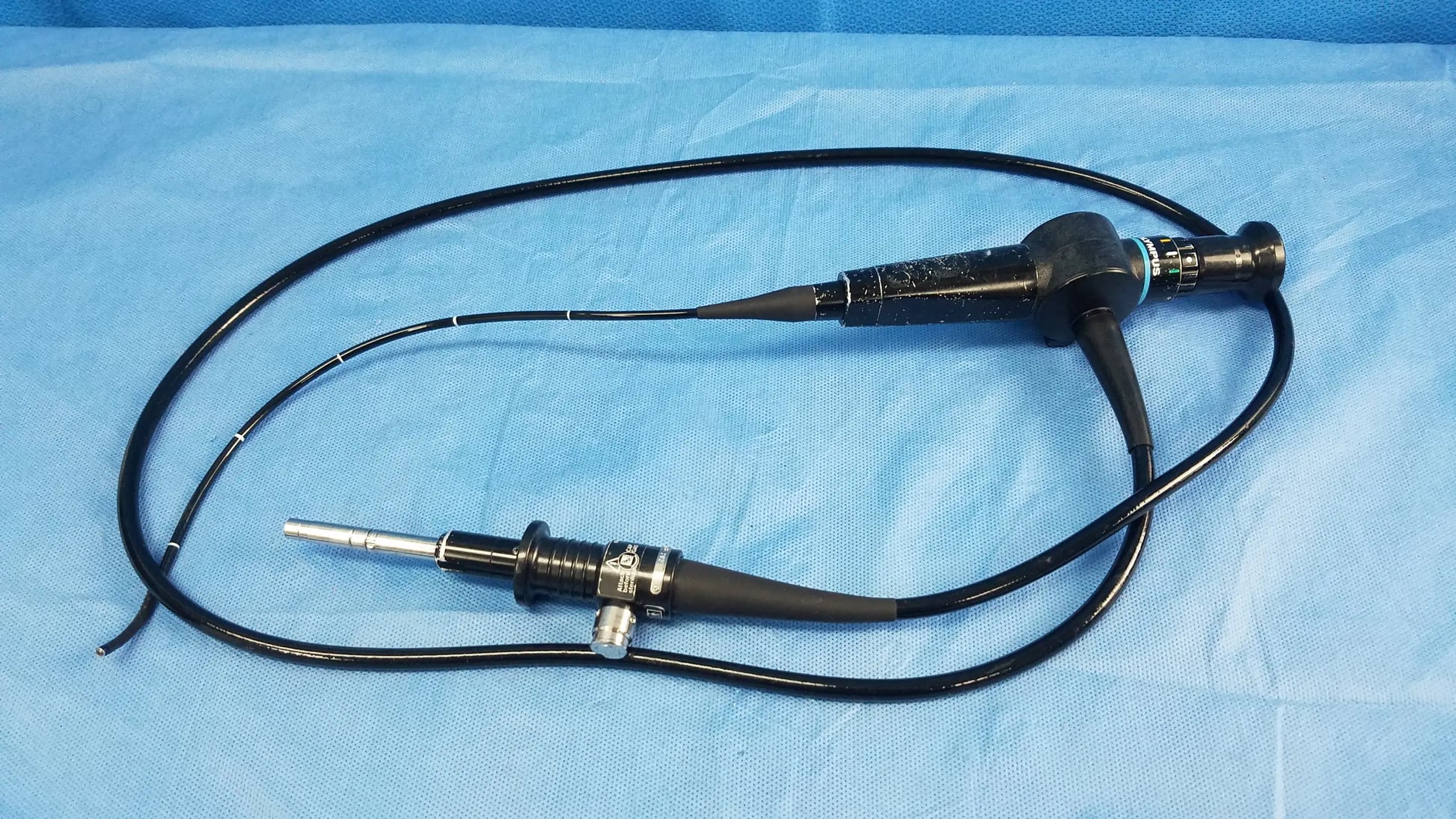 Black Olympus rhino-laryngoscope ENF-P4 fiber optic endoscope with flexible coiled cable and metallic tip components