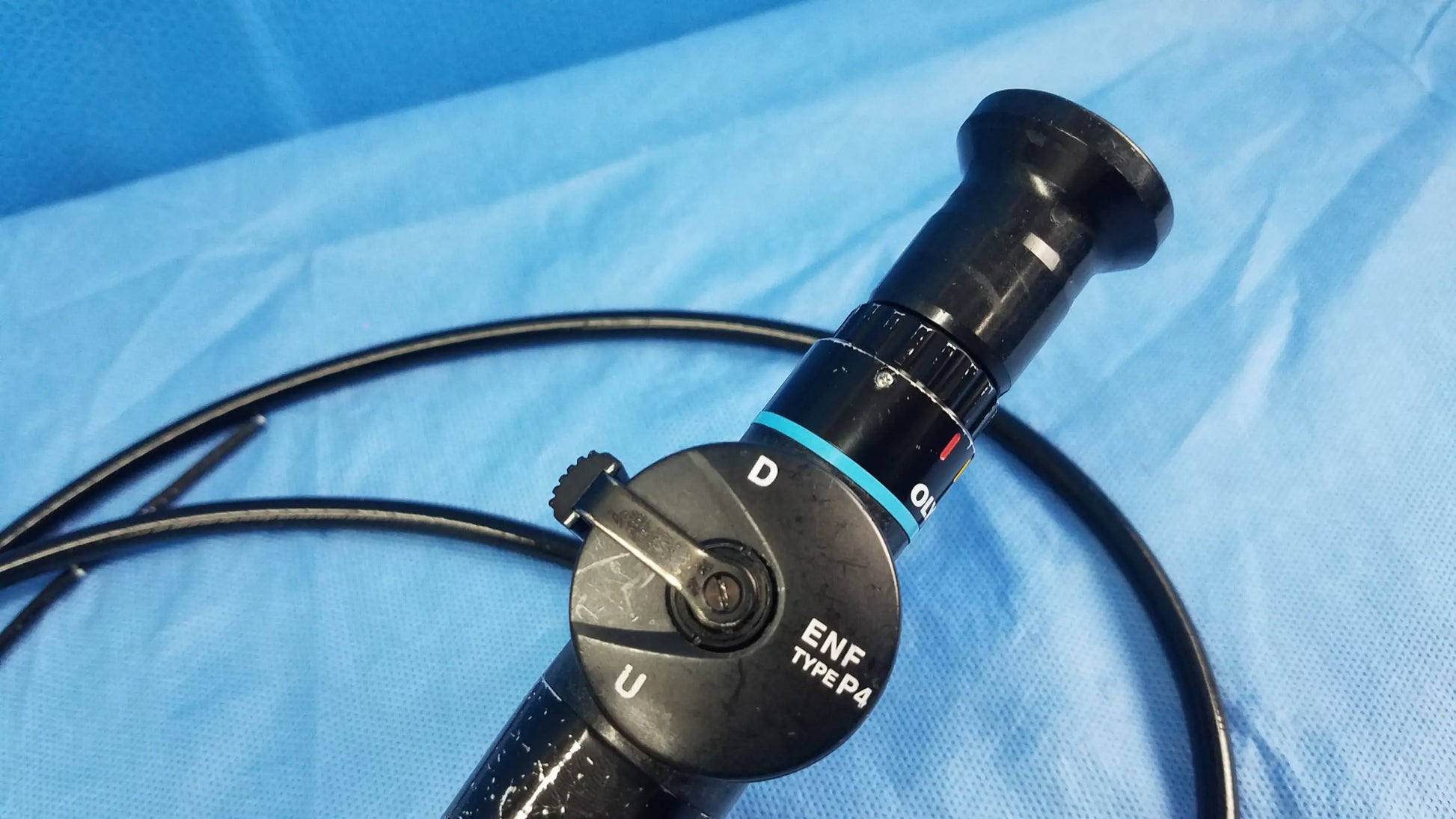 Black Olympus rhino-laryngoscope ENF-P4 flexible fiber optic endoscope with textured grip and labeled control dial