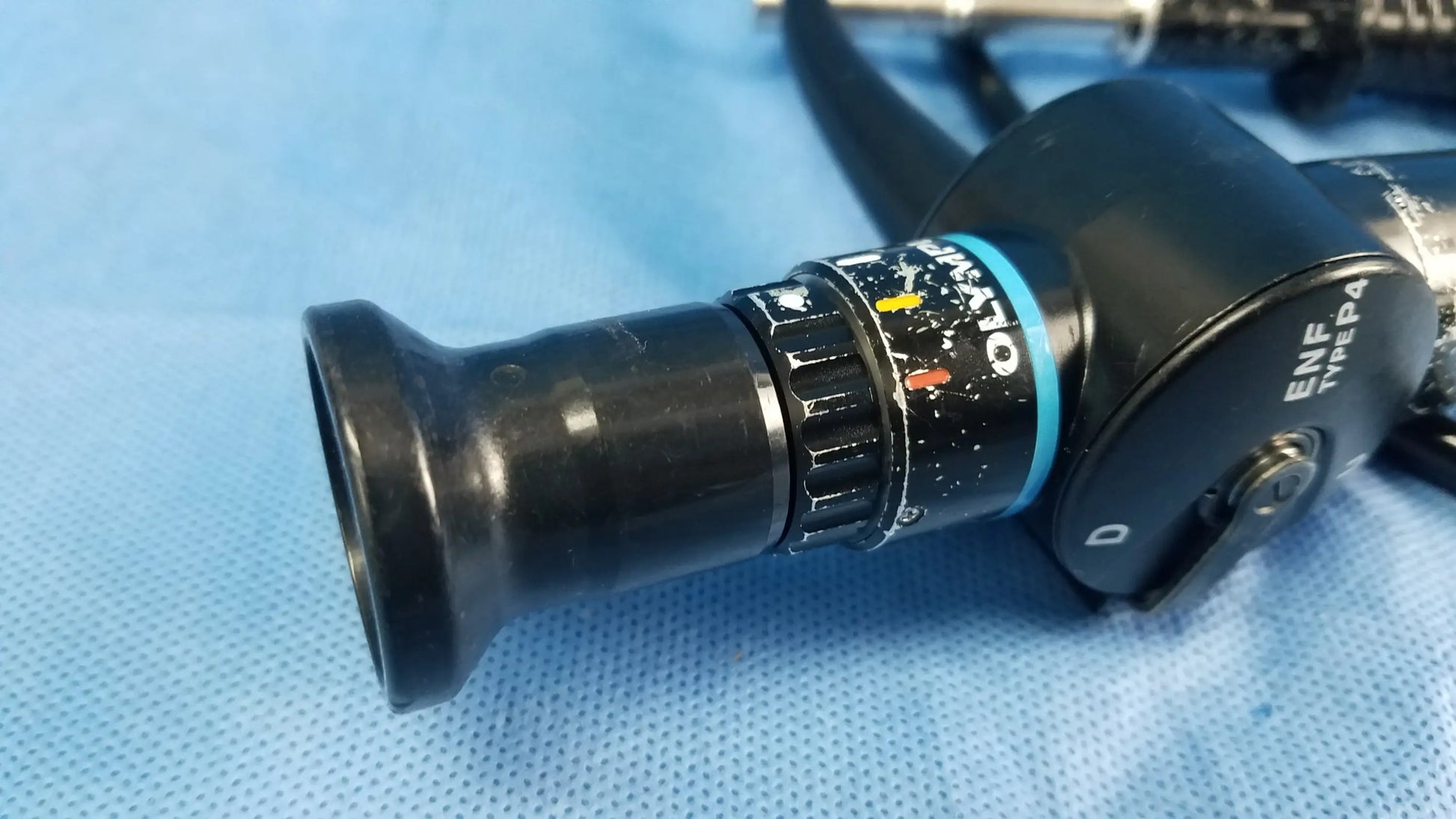 Black Olympus rhino-laryngoscope fiberscope endoscope fiber optic with textured grip and color-coded control ring