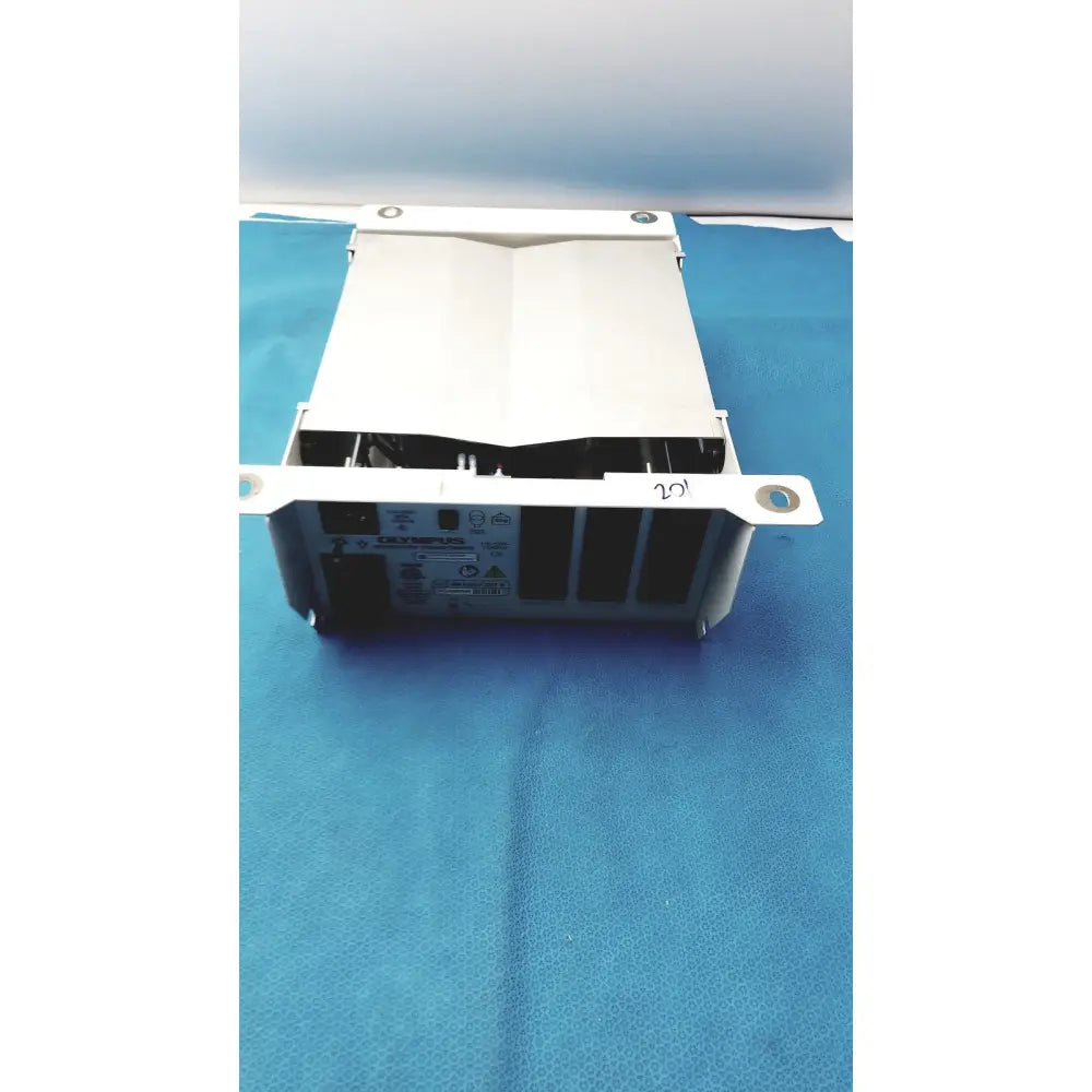 White metal olympus separation transformer maj-1647 set b with rectangular body and visible internal components