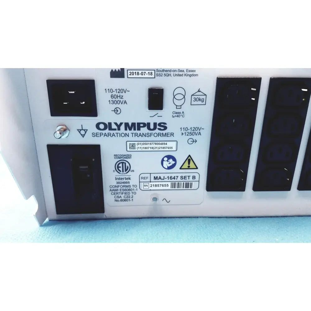 White olympus separation transformer maj-1647 set b with black power outlets and certification labels on the back side