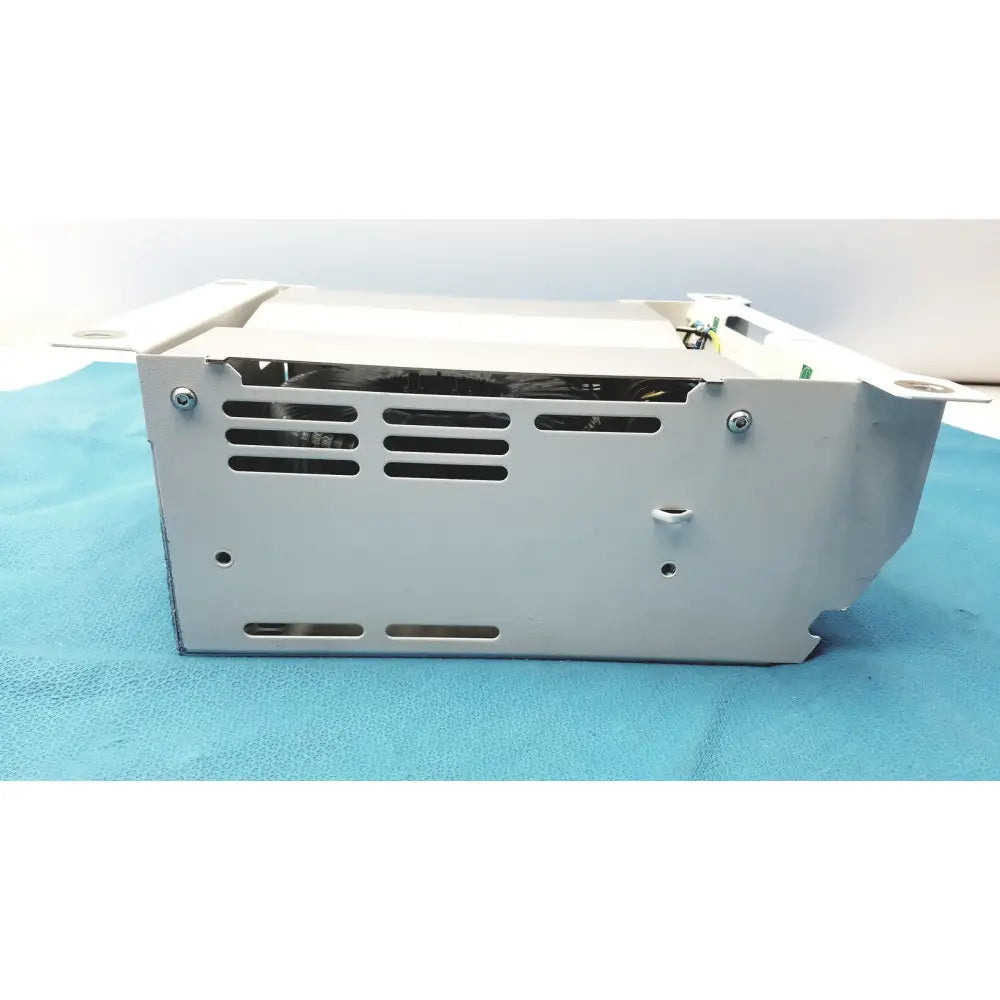 Silver metallic olympus separation transformer power supply unit with rectangular design and ventilation slots along sides