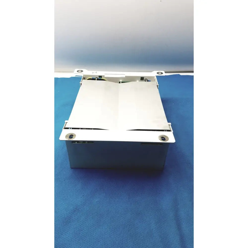 White metal cash register drawer with hinged lid and visible internal parts for olympus separation transformer use