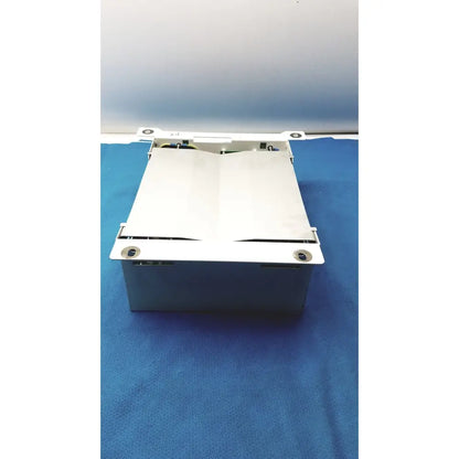 White metal cash register drawer with hinged lid and visible internal parts for olympus separation transformer use