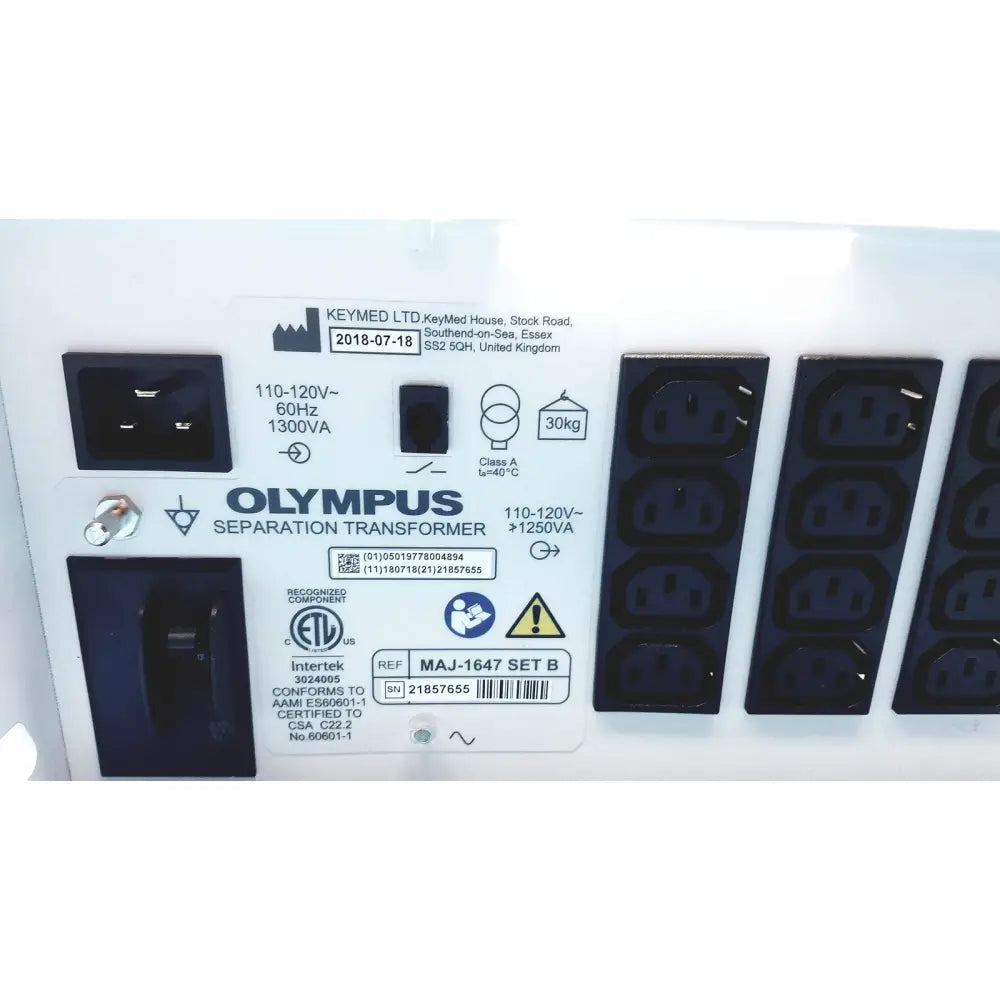 White olympus separation transformer maj-1647 set b with black power input and output sockets shown from the back side