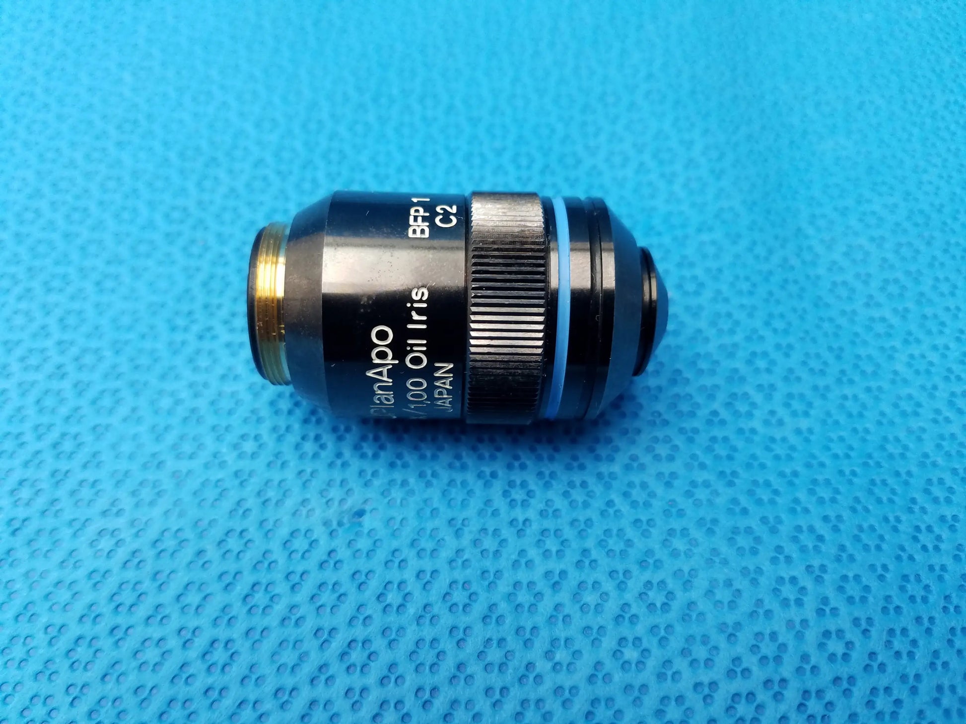 Olympus UPlanApo 40x microscope objective lens with 1.00 numerical aperture oil iris and gold threaded mount