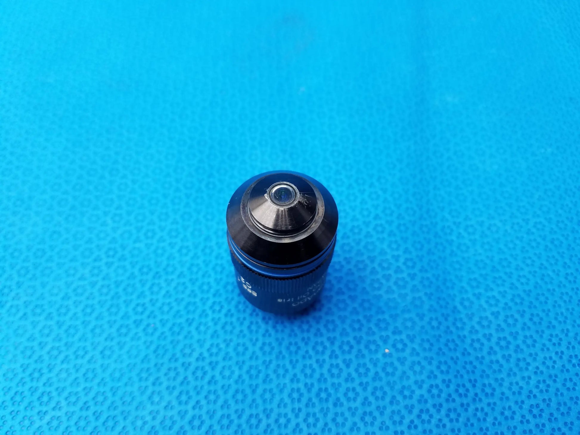 Black olympus uplanapo 40x microscope objective lens with metallic aperture and engraved numerical aperture markings