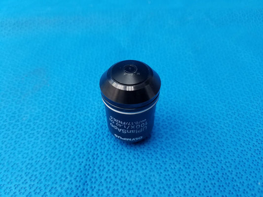 Black Olympus UPlanSApo 100x/1.40 oil immersion microscope objective with metallic finish and engraved numerical aperture
