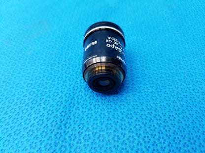 Black olympus microscope objective lens with silver rings and engraved specifications featuring high numerical aperture