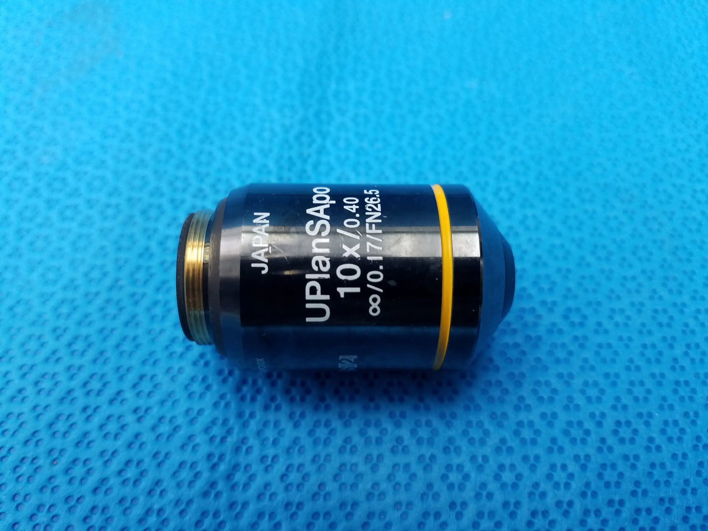 Black microscope objective lens with gold threaded mount and yellow ring compatible Olympus UPlanSApo 10x 0.40