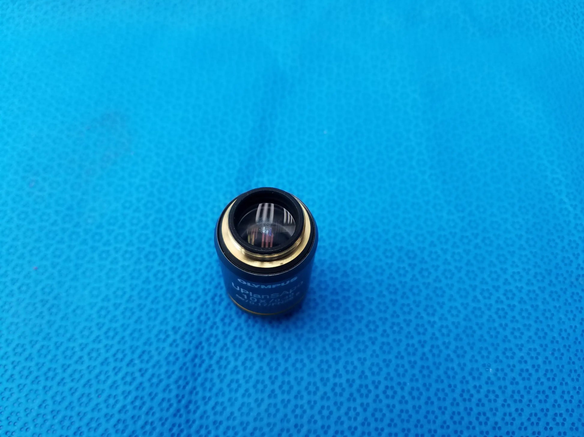 Black Olympus microscope objective lens with gold ring and clear glass element compatible Olympus UPlanSApo 10x model