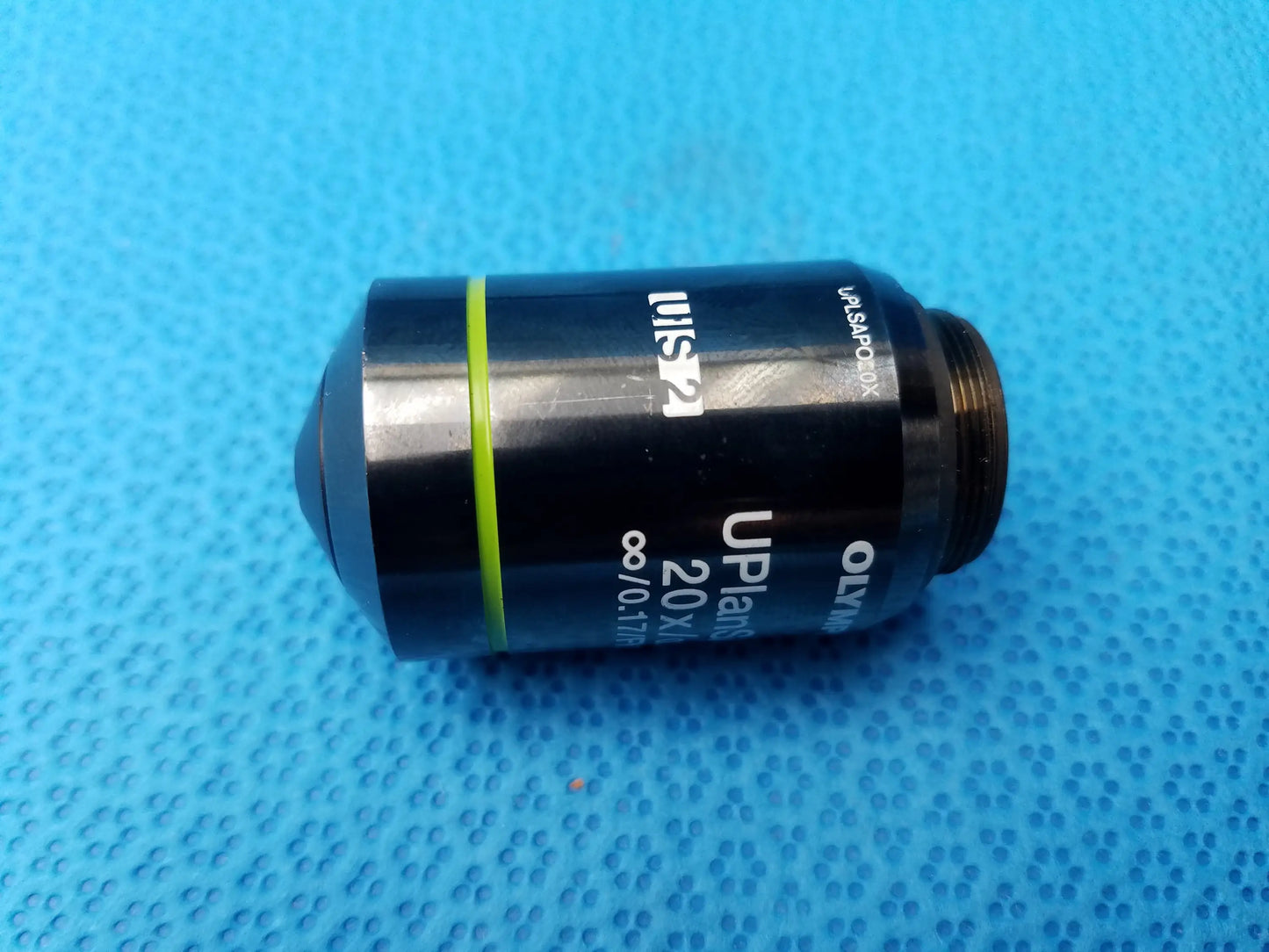 Black Olympus UPlanSApo 20x microscope objective lens with 0.75 numerical aperture and FN26.25 field number gold mount